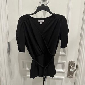 Black V-neck top with tie and ruched sleeves